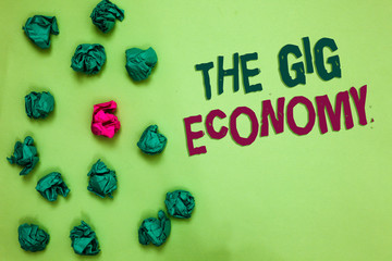 Writing note showing The Gig Economy. Business photo showcasing Market of Short-term contracts...