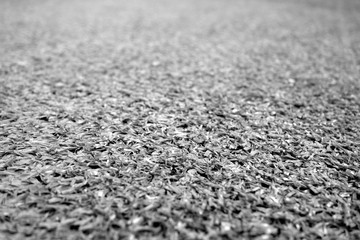 Artificial grass with blur effect in black and white.
