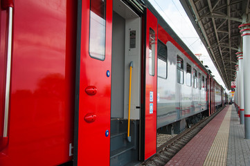 Red train in modern railway