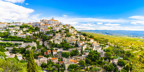 View of Gordes, a small medieval town in Provence, France. A view of the ledges of the roof of this beautiful village and landscape.