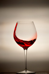 wine glass splashing on background