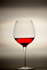 wine glass splashing on background