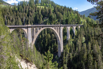 View from the historic Wiesen Viaduct of the Rhaetian Railway near the village Davos Wiesen, Swiss Alps