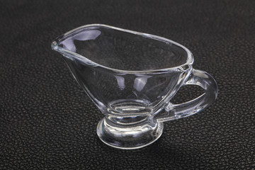 Empty glass gravy boat