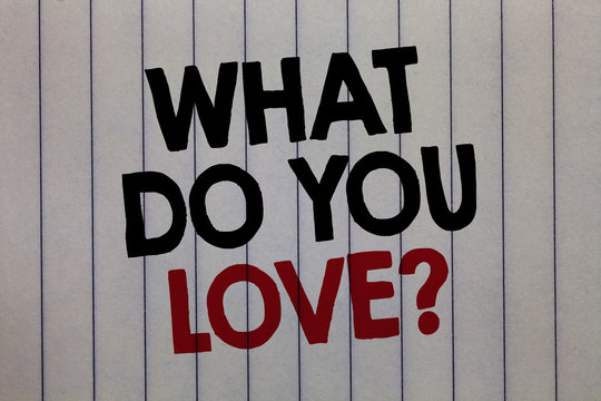 Handwriting text writing What Do You Love question. Concept meaning Enjoyable things passion for something inspiration white vertical paper written three words with black and red color