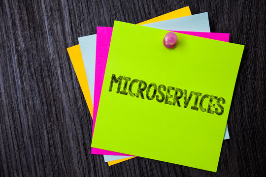 Word writing text Microservices. Business concept for Software development technique Decomposing an application Multiple sticky cards pinned coclourfull dark lining background board