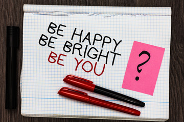 Word writing text Be Happy Be Bright Be You. Business concept for Self-confidence good attitude enjoy cheerful Color pen on written notepad with question mark black marker on woody deck