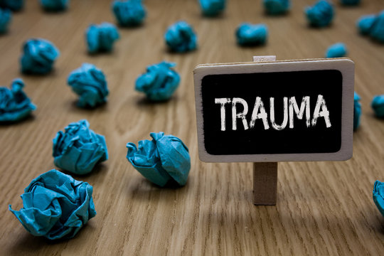 Writing note showing Trauma. Business photo showcasing Disturbing physical and emotional injuries shock experience Cyan paper imagination idea crumpled papers mistakes several tries