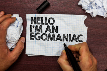 Conceptual hand writing showing Hello I am An Egomaniac. Business photo text Selfish Egocentric Narcissist Self-centered Ego Hand hold pen sketch word on torn page woody deck hand paper ball