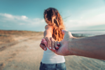a girl goes on a post holding a fellow on a hand