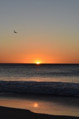 Sunset on the beach, orange, yellow and red colors.