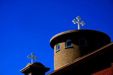 Fototapeta na wymiar Church Steeple Christian Cross White with Blue Sky