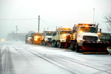 Snow Plows in Severe Blizzard Preparing for Storm