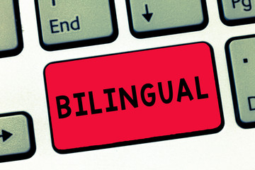 Text sign showing Bilingual. Conceptual photo speaking two languages fluently or more work as translator Keyboard key Intention to create computer message, pressing keypad idea