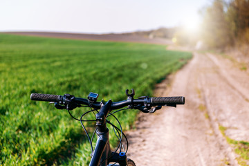 Fototapeta na wymiar Bicycle on the field road