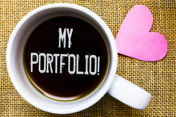 Text sign showing My Portfolio Motivational Call. Conceptual photo Samples of work Art drawings photography Tea time coffee cup office typing work jute rough background love heart