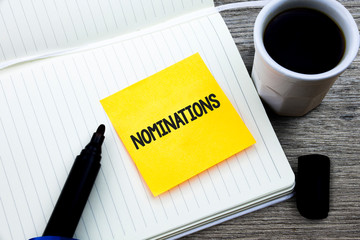 Handwriting text Nominations. Concept meaning Suggestions of someone or something for a job...