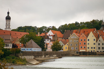 Obraz premium beautiful European city with cascading waterfalls and old houses