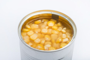 opened kernel sweet corn in brine canned , canned food isolated on white background