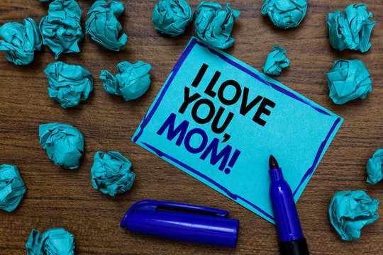 Conceptual hand writing showing I Love You, Mom. Business photo showcasing Loving message emotional feelings affection warm declaration written blue letters on page blue marker and paper lumps