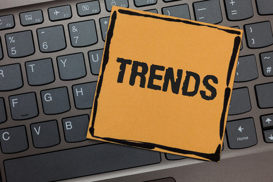 Handwriting text writing Trends. Concept meaning General projected directions of something according to time Black laptop keyboard art paper computer notebook netbook keypad key