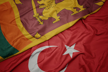 waving colorful flag of turkey and national flag of sri lanka.
