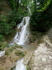 Fototapeta na wymiar waterfall in the mountains near Lake Hamory