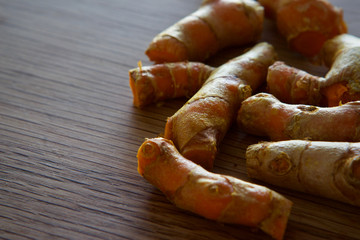 Fresh Turmeric on an oak table