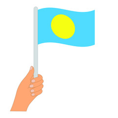 Flag of Palau. Hand holding a Palau flag - vector icon.