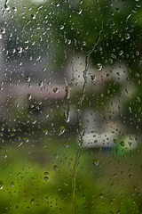 Rain drops on window viewed from interior.