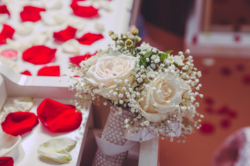 Red petals . bedom mirror . White flower bouquet for the wedding.
