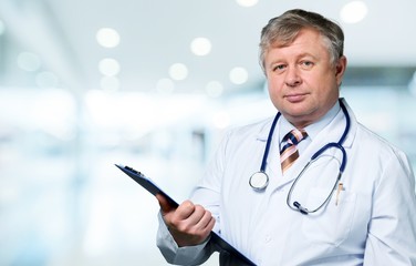 Young man doctor holding stethoscope