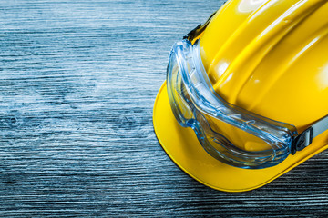 Safety cap goggles on vintage wooden board