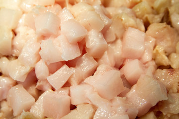 Frying chopped pieces of lard