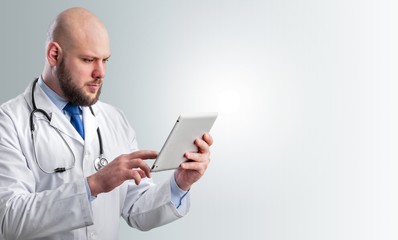 Close-up Doctor at hospital working with tablet pc