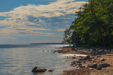 clouds over deserted shore of Baltic sea