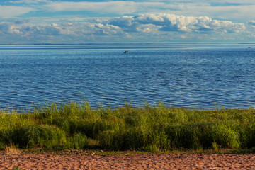 fishing on calm Baltic sea in sunny weather