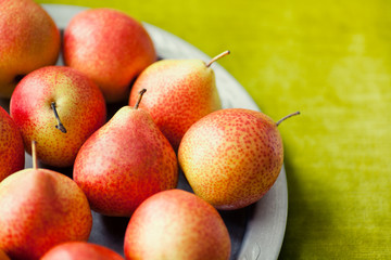 Fresh Forelle pears on a plate. 