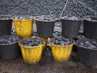 Buckets of fossil fuel ready to be burned