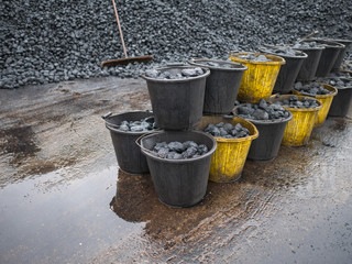 Buckets of fossil fuel ready to be burned - obrazy, fototapety, plakaty