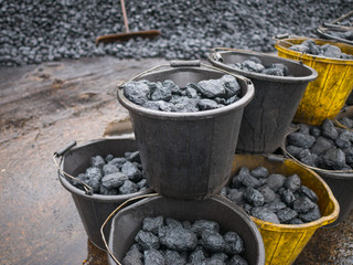 Buckets of fossil fuel ready to be burned