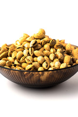 nuts almonds in the shell, lay in a bowl, on a white background