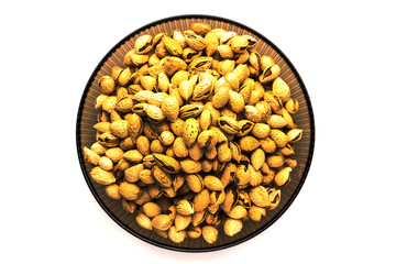 nuts almonds in the shell, lay in a bowl, on a white background