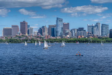 Boston skyline from the Charles river and Cambridge with sail boats