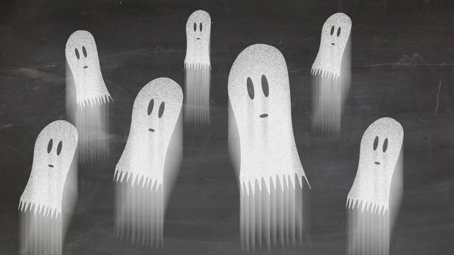 Happy Halloween illustrated with ghosts  on blackboard.