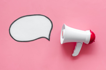 Announcement with megaphone and bubble on pink background top view mock up