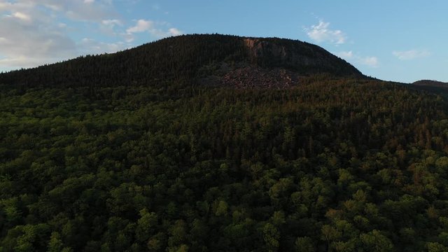 Aerial flight over Bodfish Valley towards forestry mountain top 4K