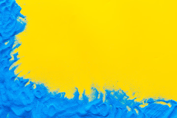 Blog or presentation background with blue sand frame on yellow background top view copyspace