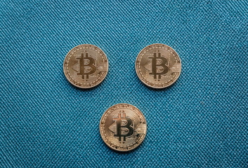 Group of three bitcoin coins, the most important cryptocurrency today and that is an alternative to...