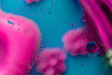 Micro molecular abstract pattern of colored oil bubbles on water. 